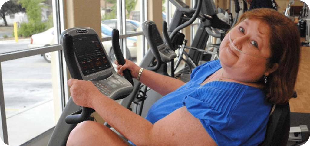 Physical therapy patient exercising on stationary bike